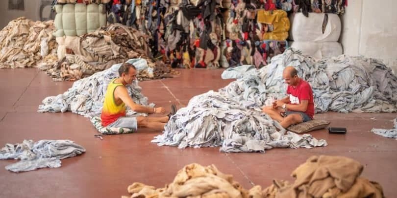 Two men sitting in a Patagonia clothing factory