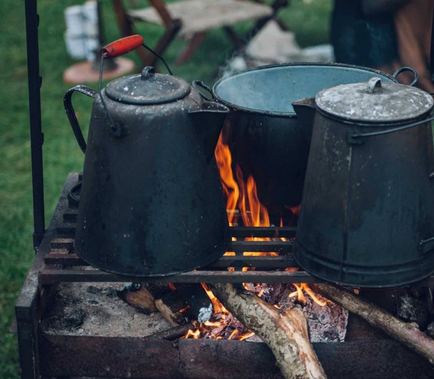 Old kettle on a fireplace outside